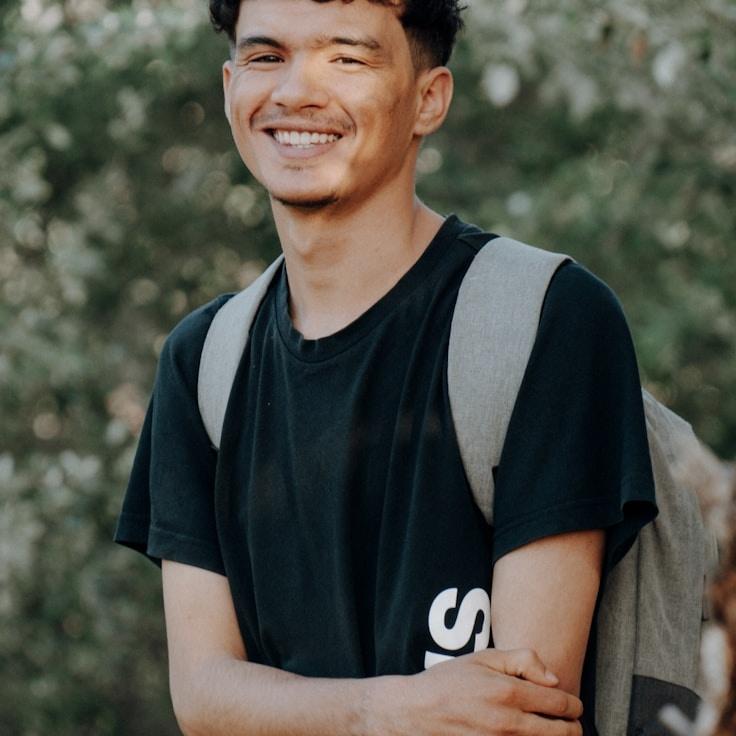 Jane Doe, Lead Design Curator at Meadow Moss Fern, reviewing corporate floral arrangements